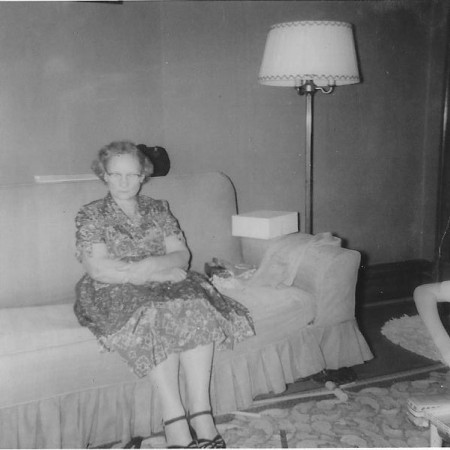 Grandmother seated on couch